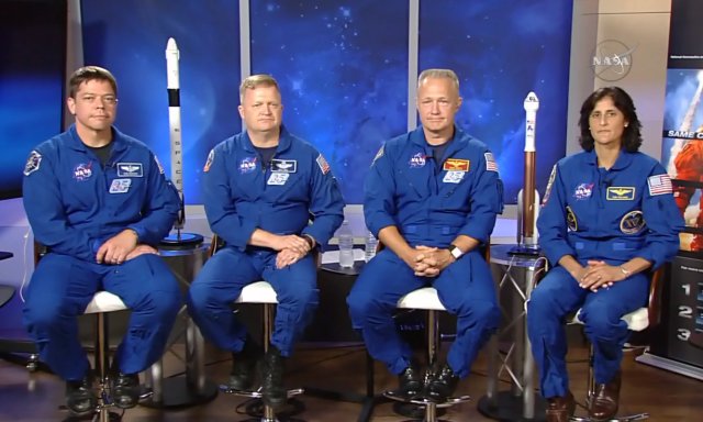 In this image made from a video provided by NASA, astronauts, from left, Bob Behnken, Eric Boe, Doug Hurley and Suni Williams gather for an interview at the Johnson Space Center in Houston on July 10, 2015.