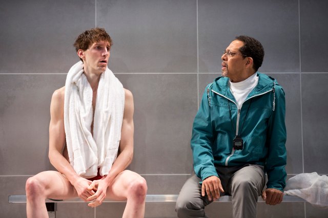 Alex Breaux, left, and Peter Jay Fernandez in a scene from the play "Red Speedo" at the New York Theater, Feb. 10, 2016. Breaux, formerly a Harvard wide receiver who opted for an acting career, plays a champion swimmer in the play. (Sara Krulwich/The New York Times)